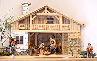 Bild: Abbildung von einem Holzhaus mit verschiedenen Grippentieren.